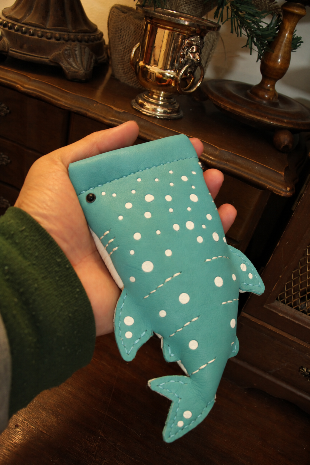 Turquoise Baby Whale Shark Wallet held in a hand