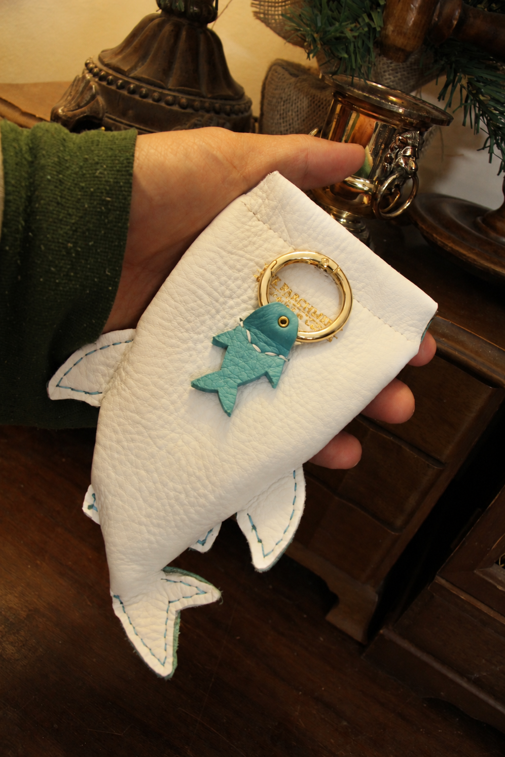 White underside of Baby Whale Shark Wallet with a blue fish keyring tab