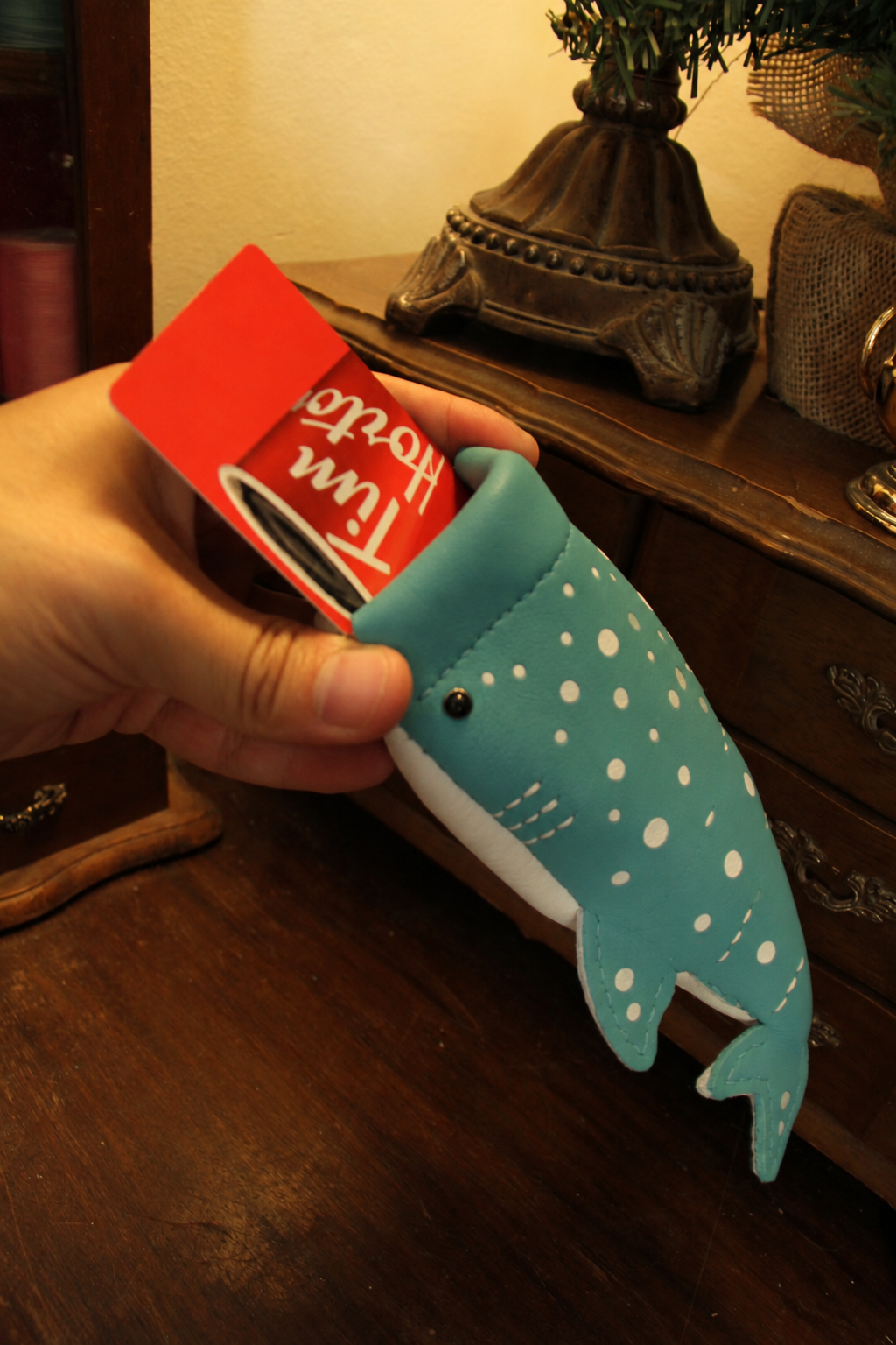 Baby Whale Shark Wallet held in a hand with cards inside