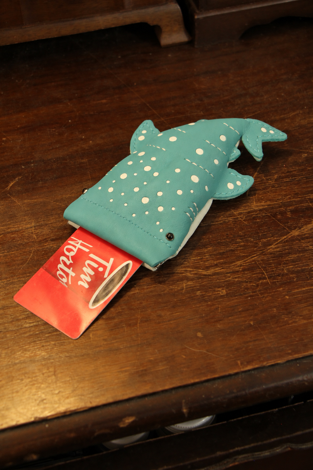 Baby Whale Shark Wallet holding a card