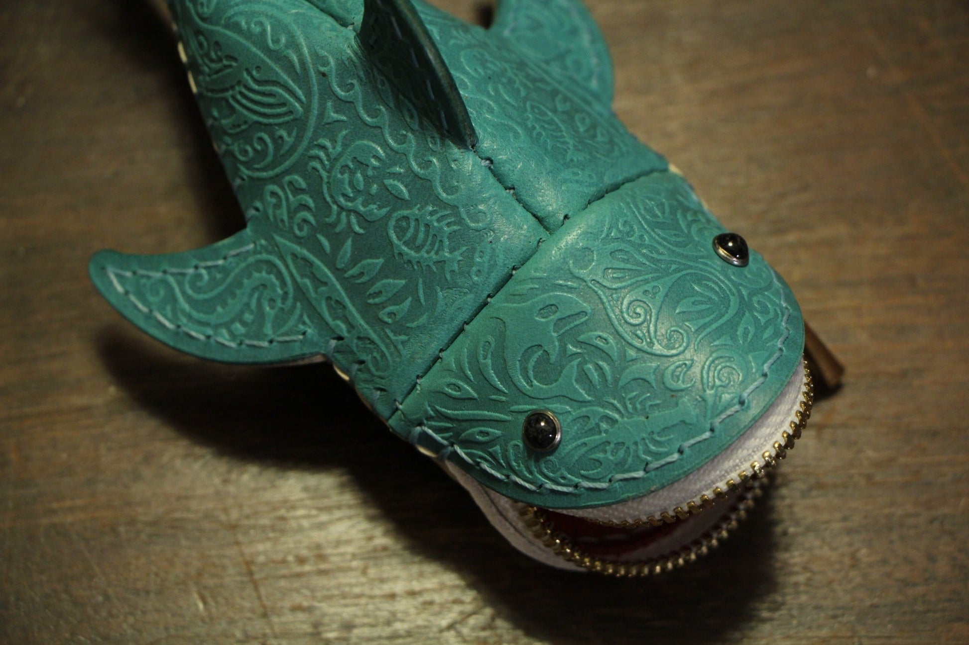 Close-up of embossed pattern on shark leather coin purse