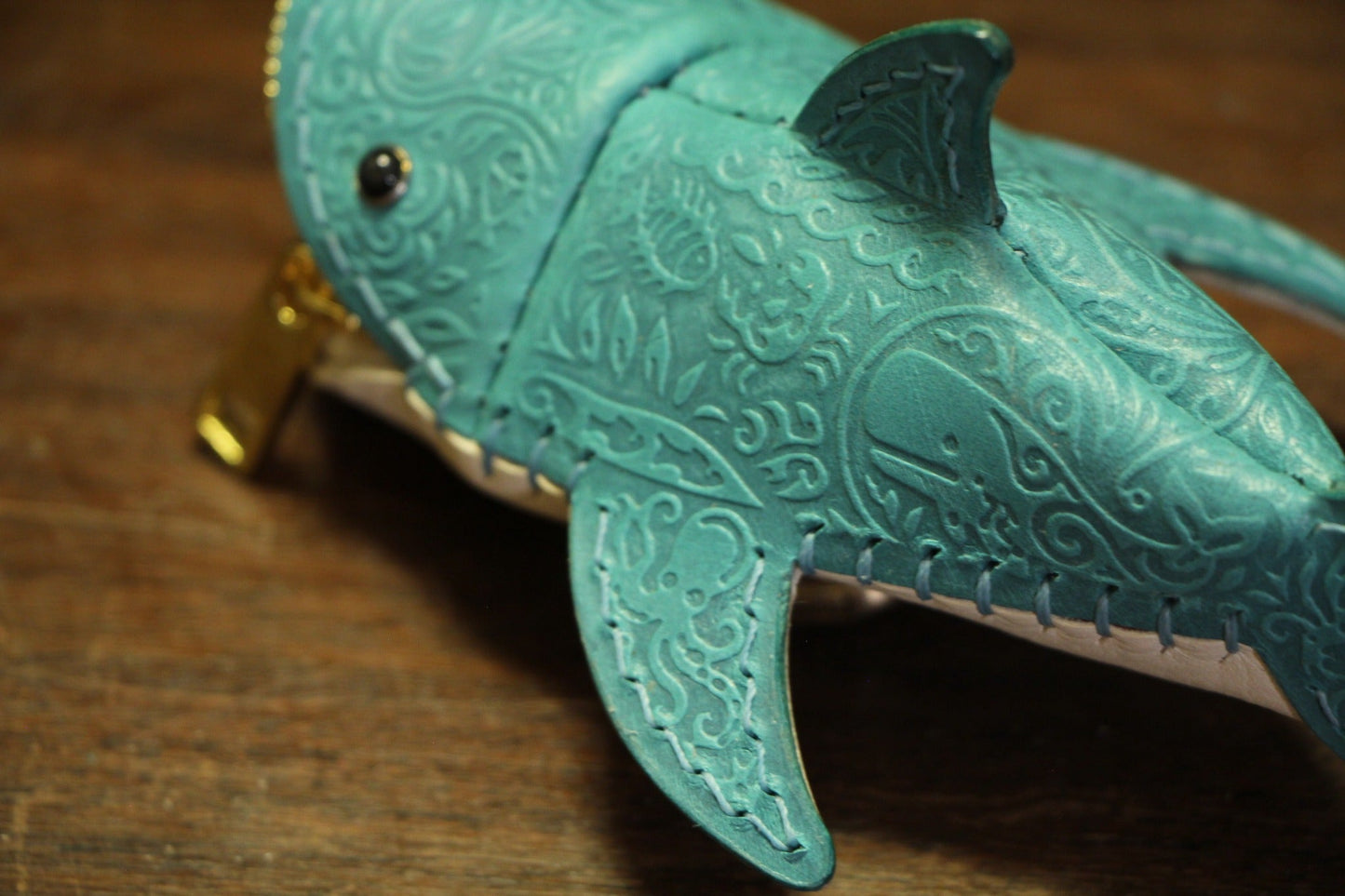 Embossed pattern and hand stitching on shark leather coin purse